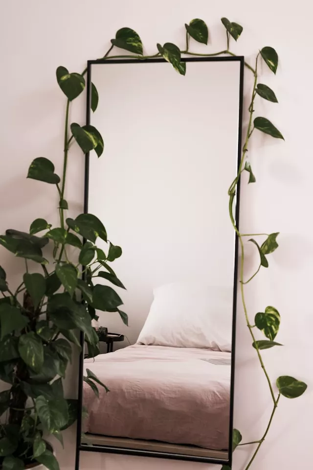 Mirrors facing the bed partially covered with a soft linen cloth, a simple feng shui fix for better sleep